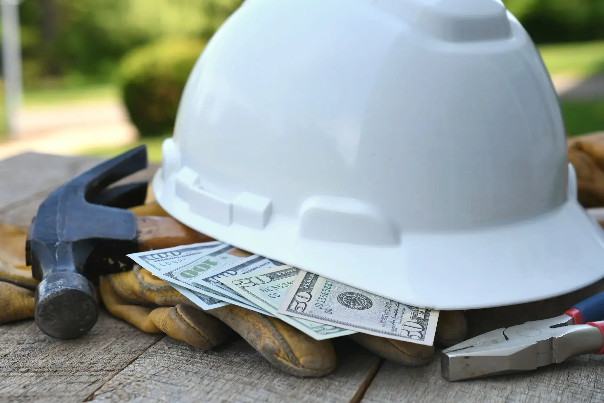 Construction contractor's hard hat and tools representing accounting and tax support for construction businesses.